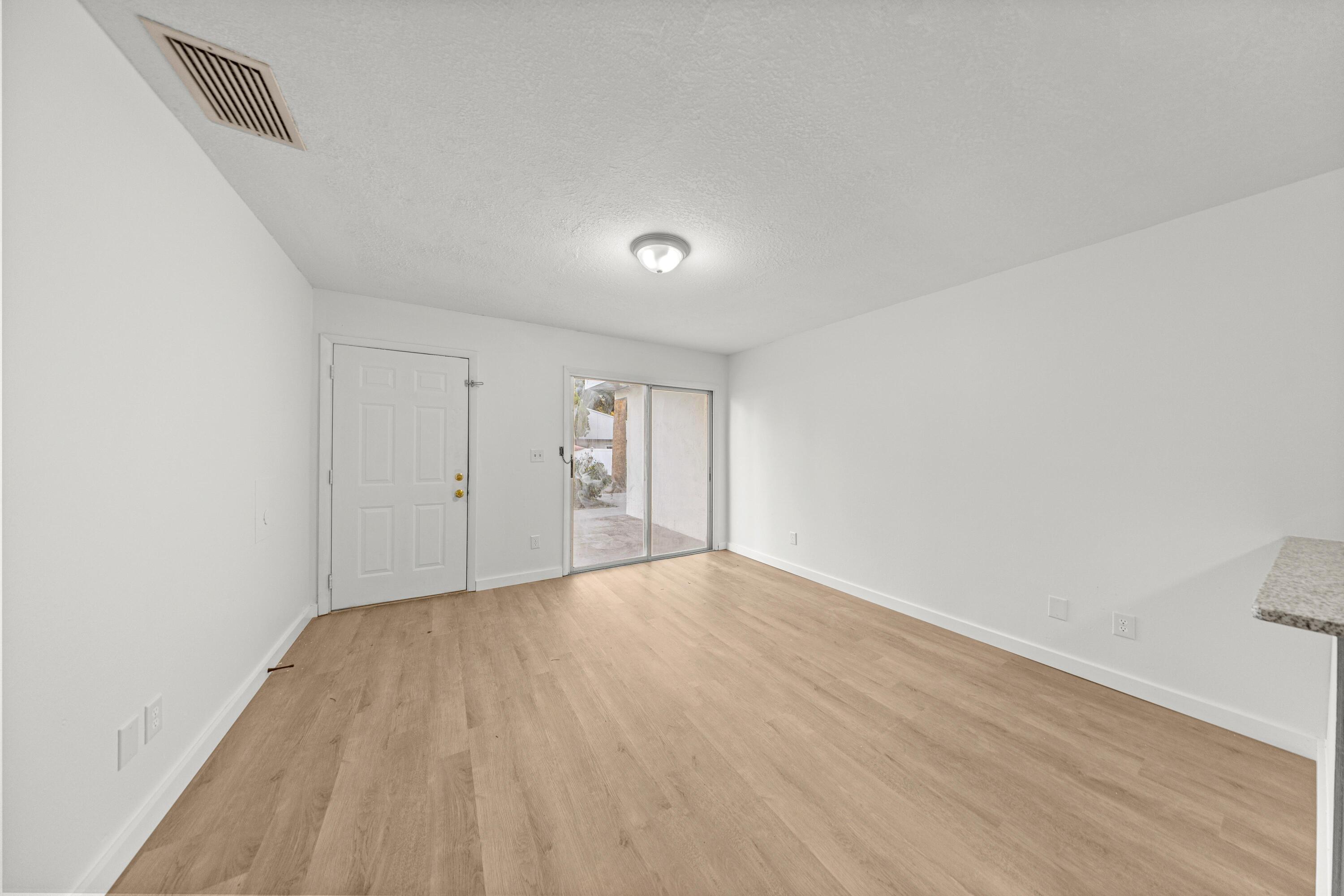 2931 Southeast 52nd Avenue Ocala, FL 34480 - Photo 33 of 52 an empty room with wooden floor and windows