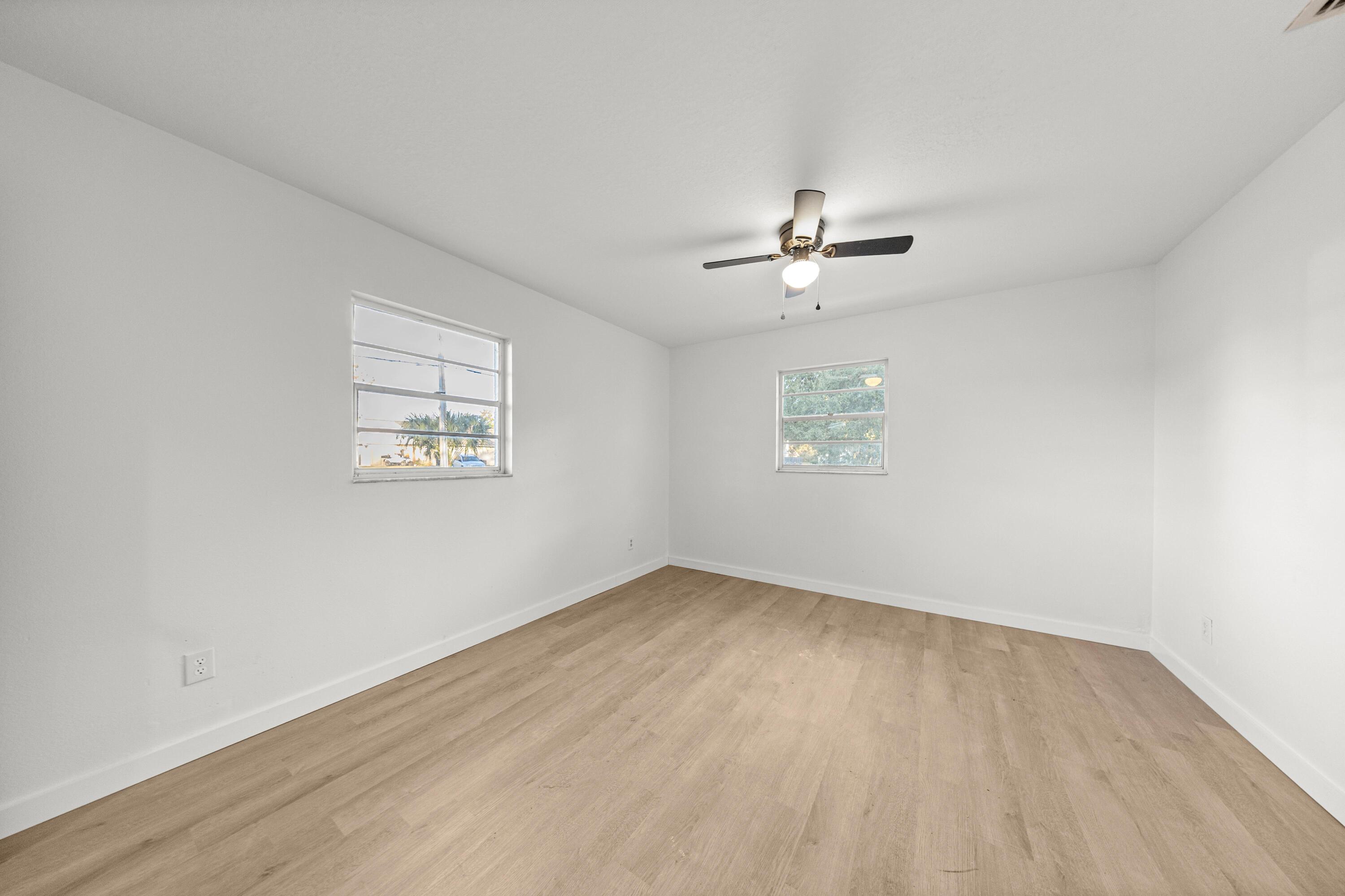 2931 Southeast 52nd Avenue Ocala, FL 34480 - Photo 35 of 52 an empty room with a window and a ceiling fan