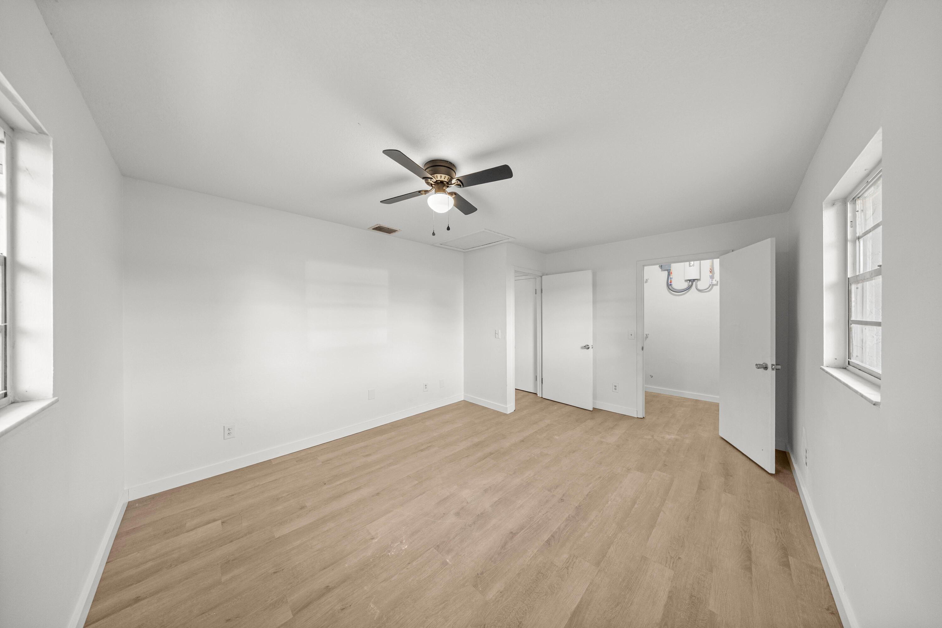 2931 Southeast 52nd Avenue Ocala, FL 34480 - Photo 36 of 52 wooden floor in an empty room with a window