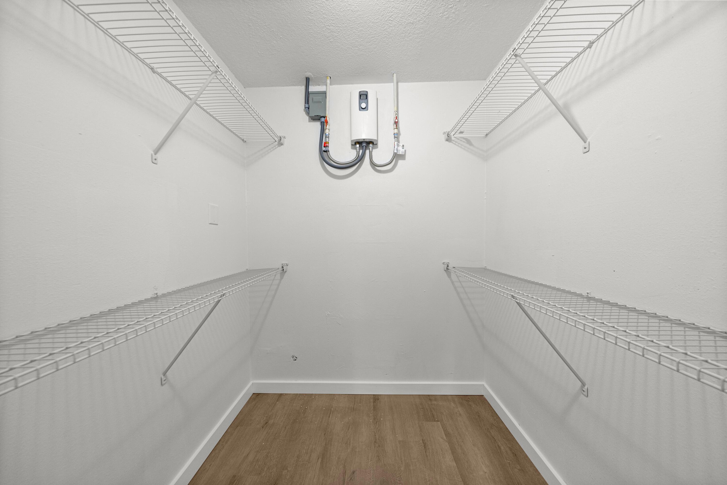 2931 Southeast 52nd Avenue Ocala, FL 34480 - Photo 37 of 52 a view of walk in closet with empty racks