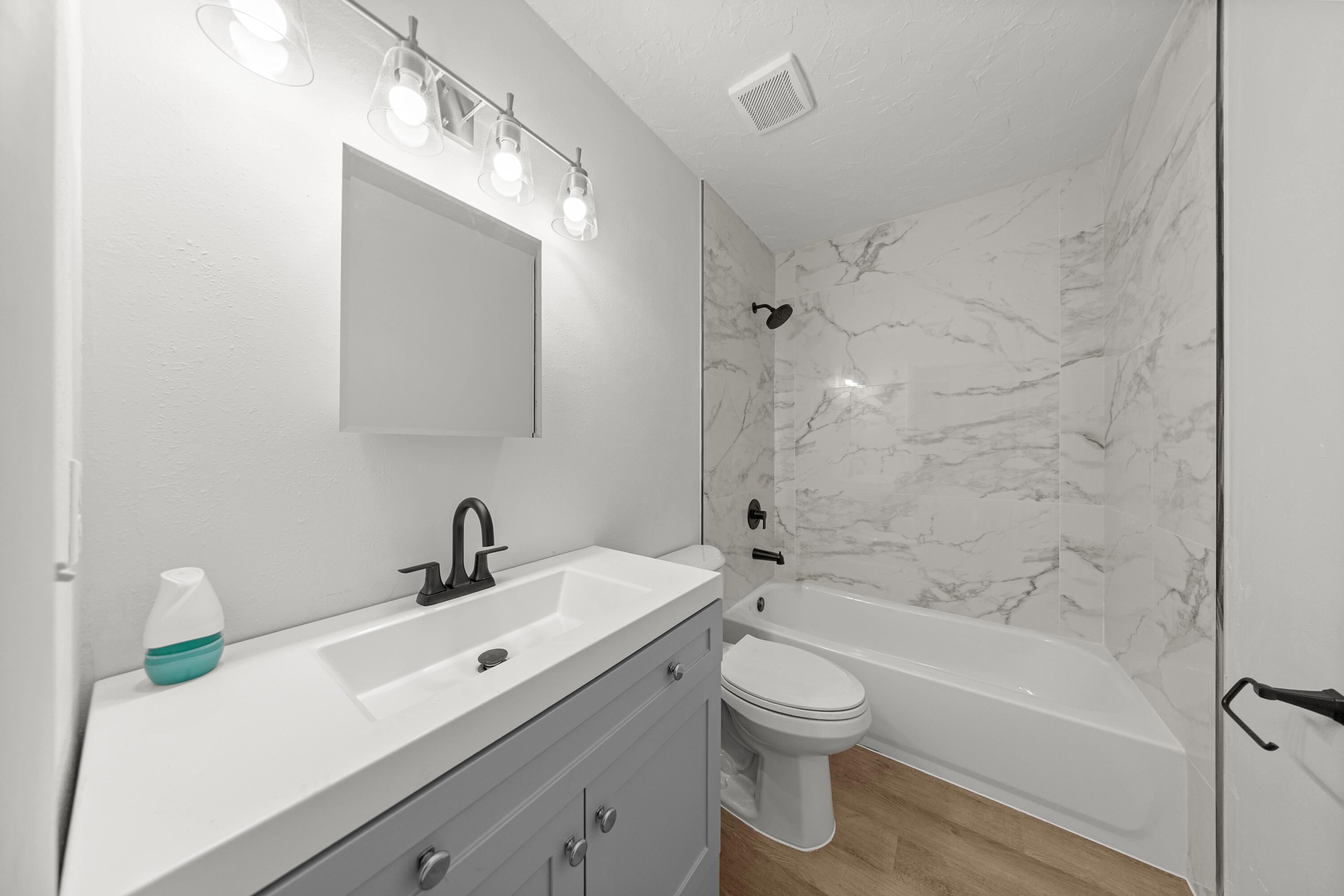 2931 Southeast 52nd Avenue Ocala, FL 34480 - Photo 49 of 52 a bathroom with a sink a toilet and shower