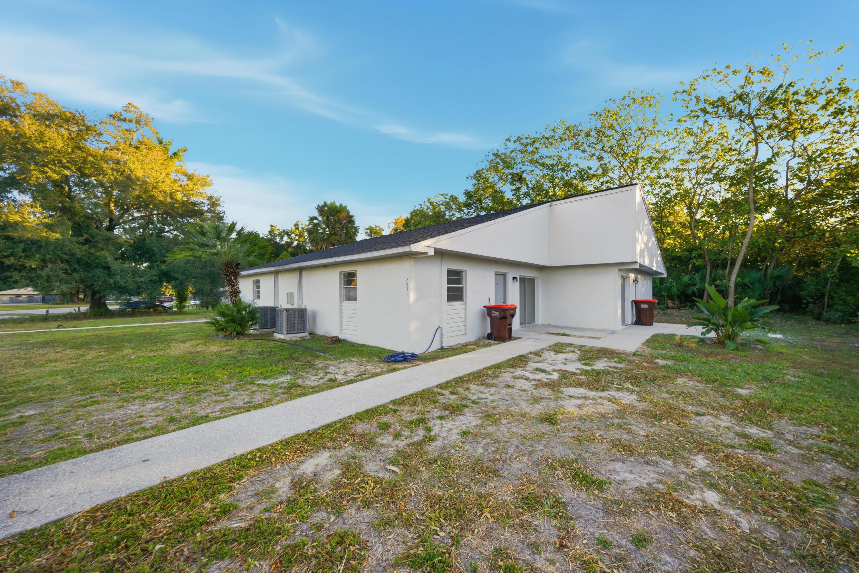 2931 Southeast 52nd Avenue Ocala, FL 34480 - Photo 6 of 52 a view of backyard of house with green space