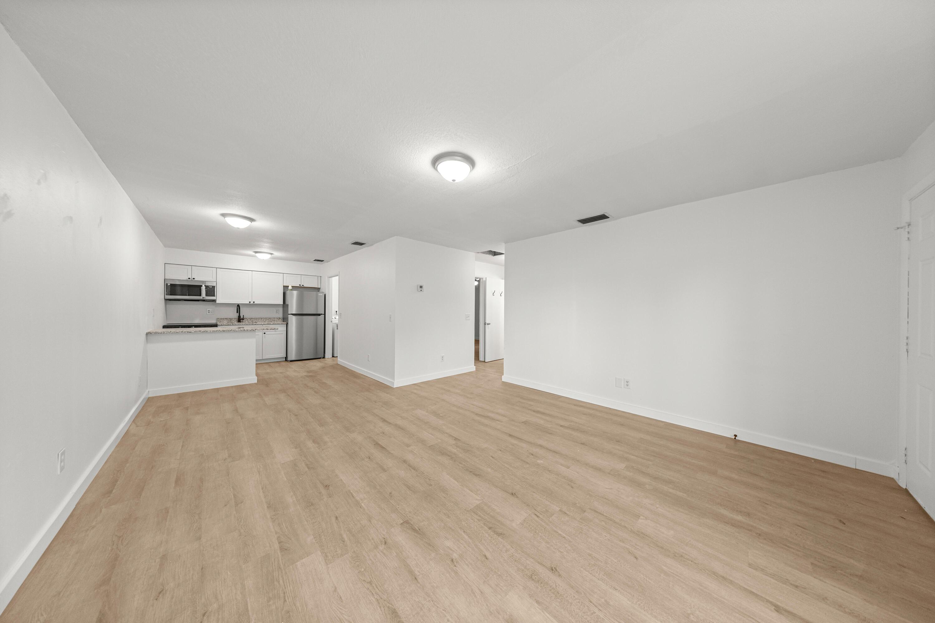 2931 Southeast 52nd Avenue Ocala, FL 34480 - Photo 8 of 52 a view of empty room with wooden floor