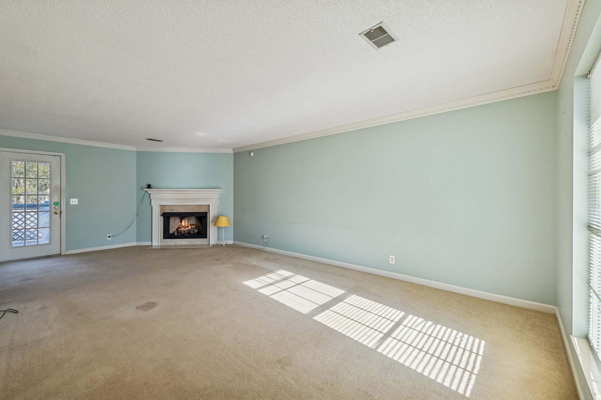 3508 Daisy Trail Antioch, TN 37013 - Photo 11 of 46 a view of an empty room with a fireplace and a window