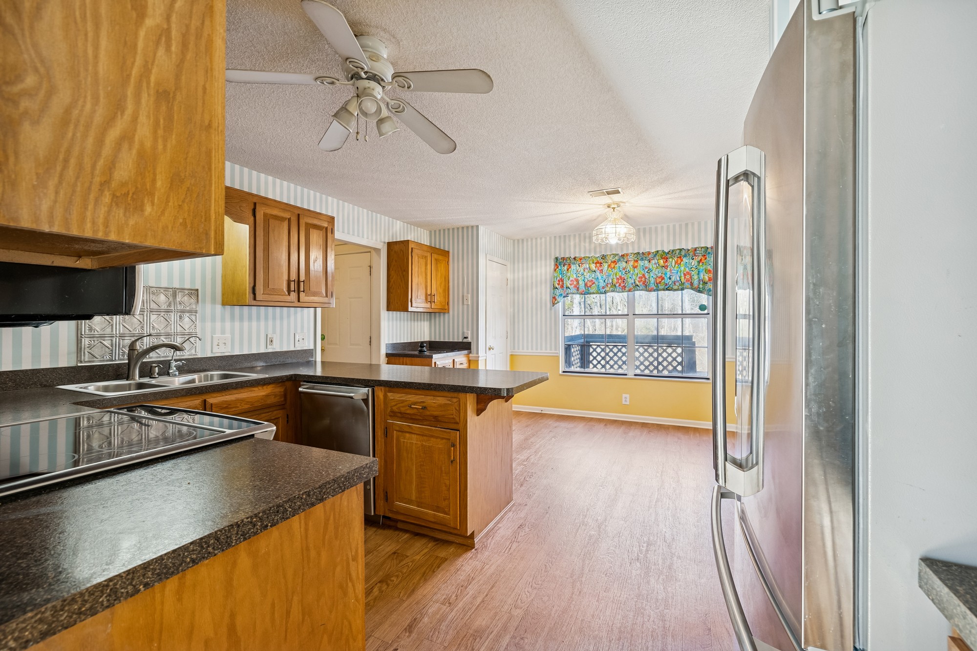 3508 Daisy Trail Antioch, TN 37013 - Photo 16 of 46 a kitchen with stainless steel appliances granite countertop a sink stove and refrigerator