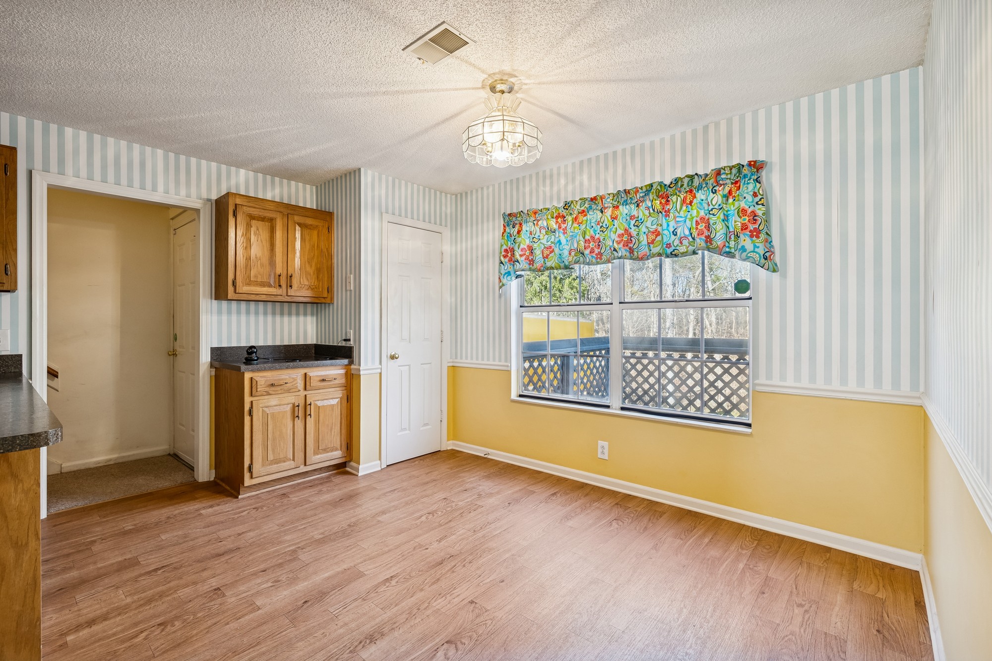 3508 Daisy Trail Antioch, TN 37013 - Photo 18 of 46 a view of an empty room with a window and wooden floor
