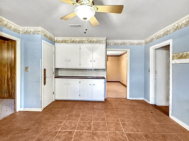 412 Neal Street Jasper, TX 75951 - Photo 5 of 22 a view of a kitchen with a dishwasher and a refrigerator