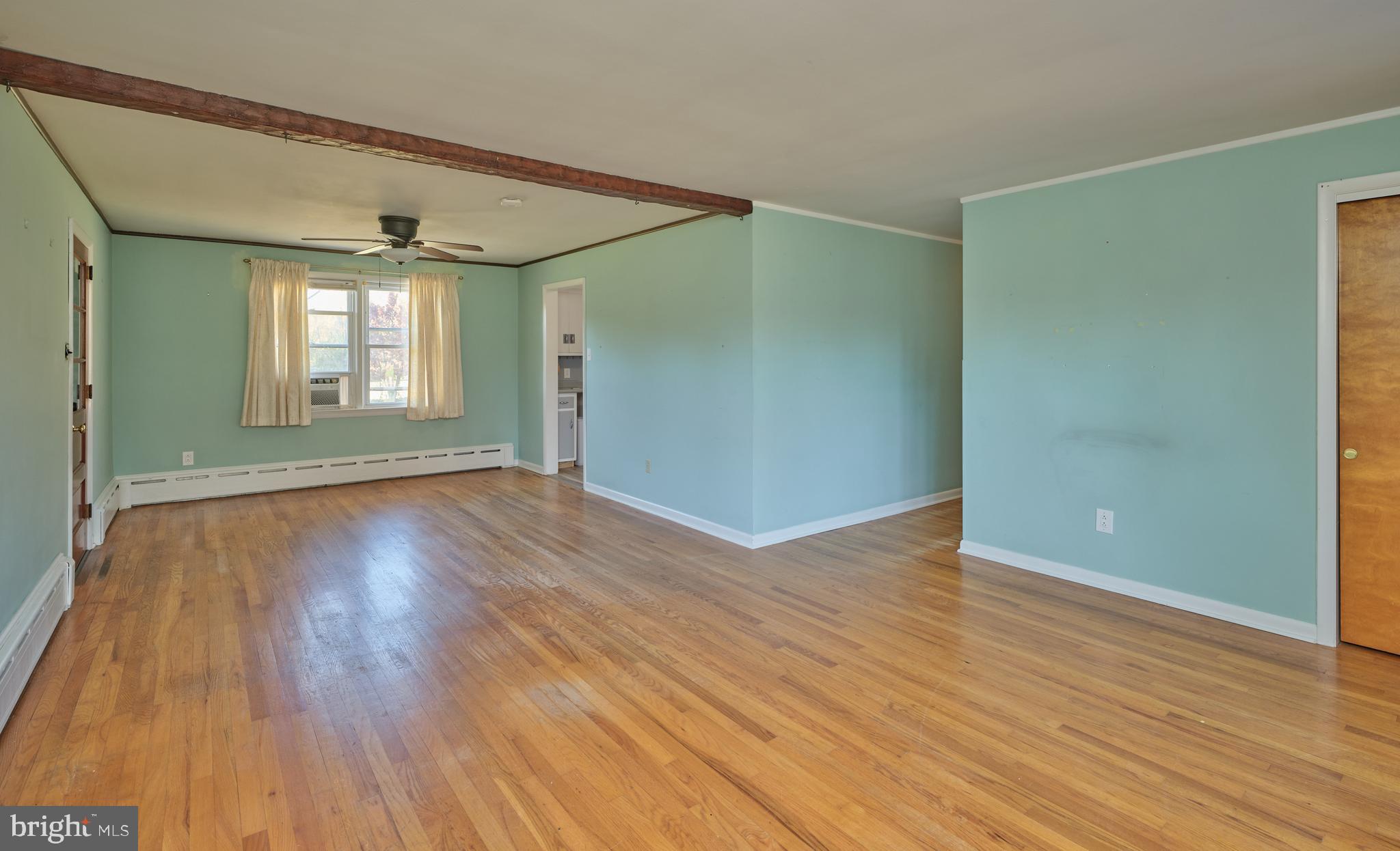 228 Iron Hill Road Doylestown, PA 18901 - Photo 14 of 33 an empty room with wooden floor and windows