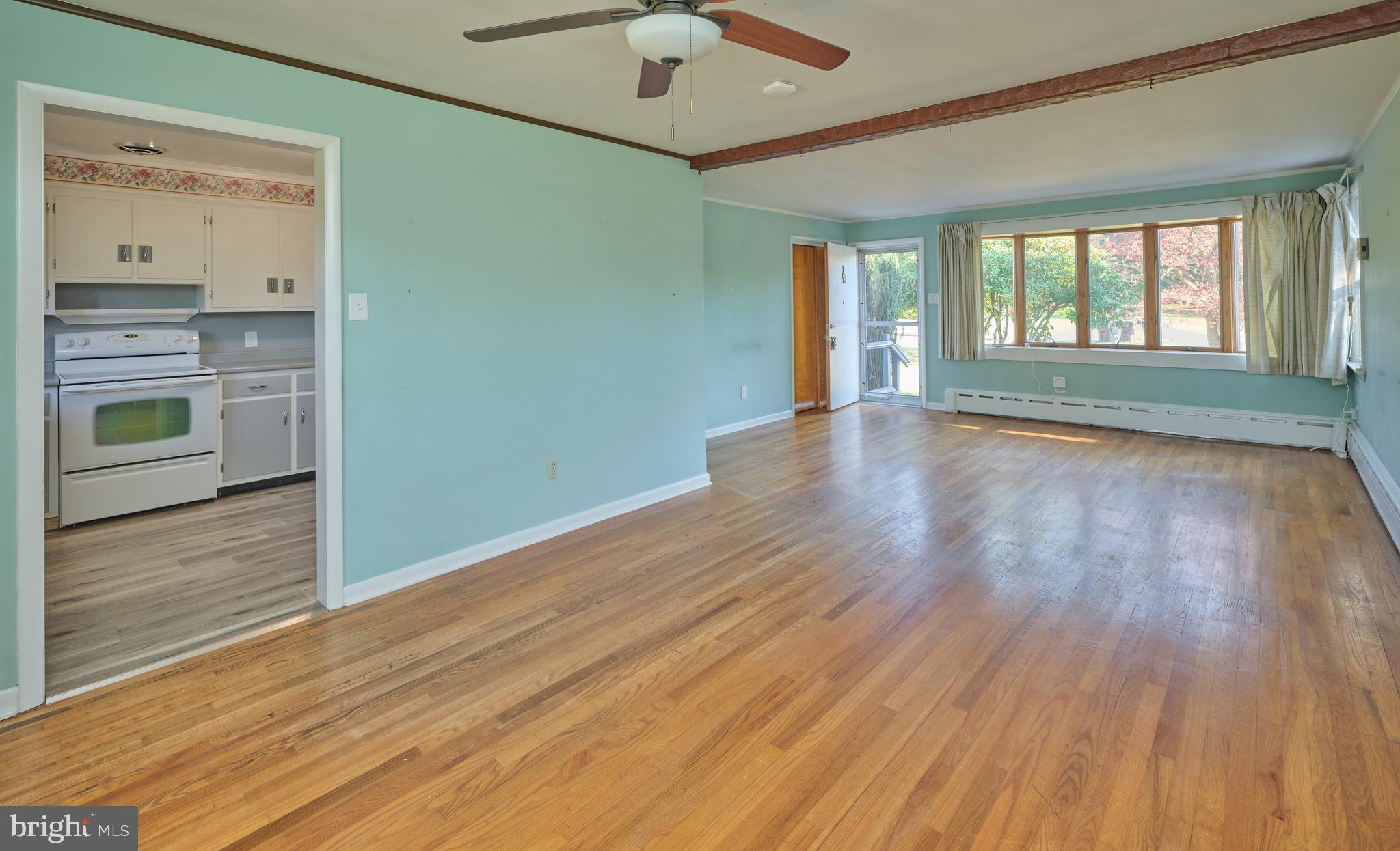 228 Iron Hill Road Doylestown, PA 18901 - Photo 15 of 33 a view of an empty room with a window and wooden floor