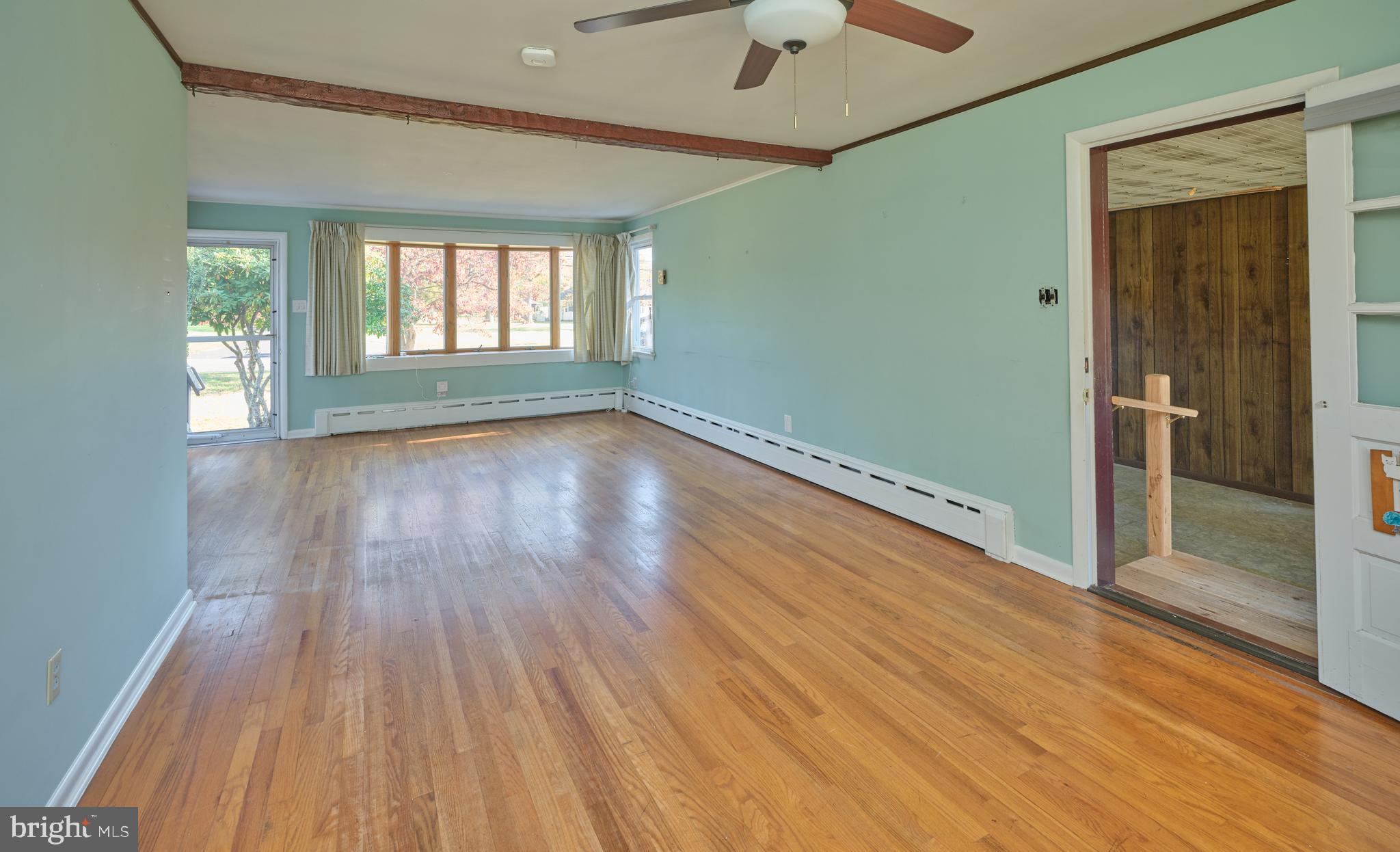 228 Iron Hill Road Doylestown, PA 18901 - Photo 16 of 33 a view of an empty room with wooden floor and a window