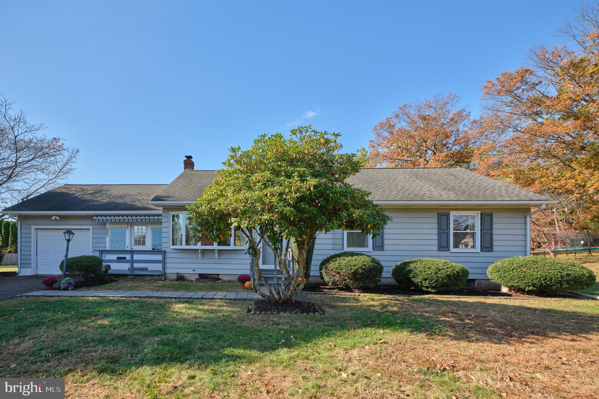 228 Iron Hill Road Doylestown, PA 18901 - Photo 5 of 33 a front view of a house with a yard and garage