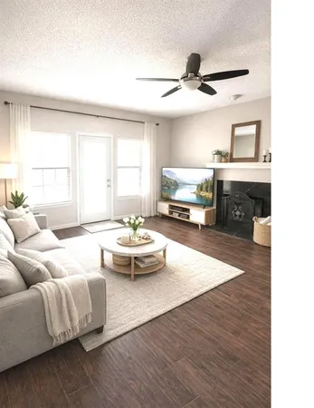 a living room with furniture and a fireplace