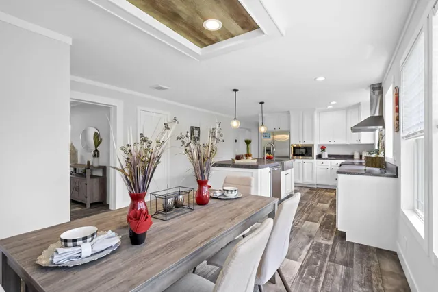 a living room with kitchen island furniture and a wooden floor