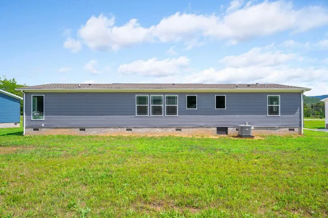 a front view of house with yard and seating area