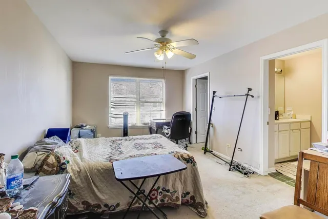a view of a dining room with furniture and a window