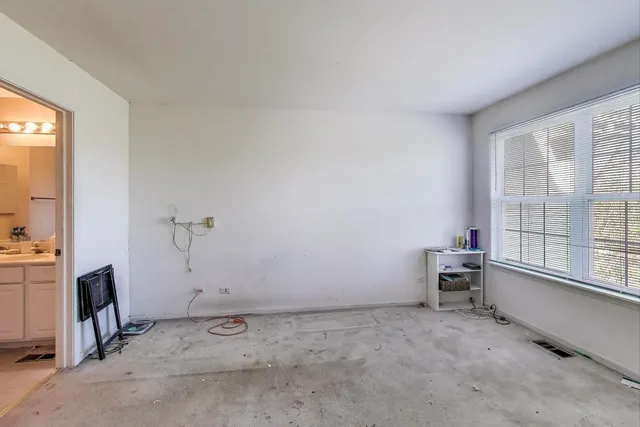 a bathroom with a sink mirror and toilet