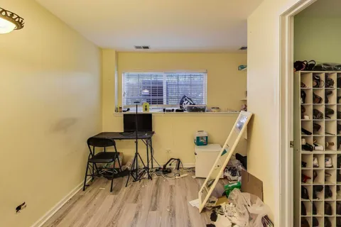 a view of a brick house with windows
