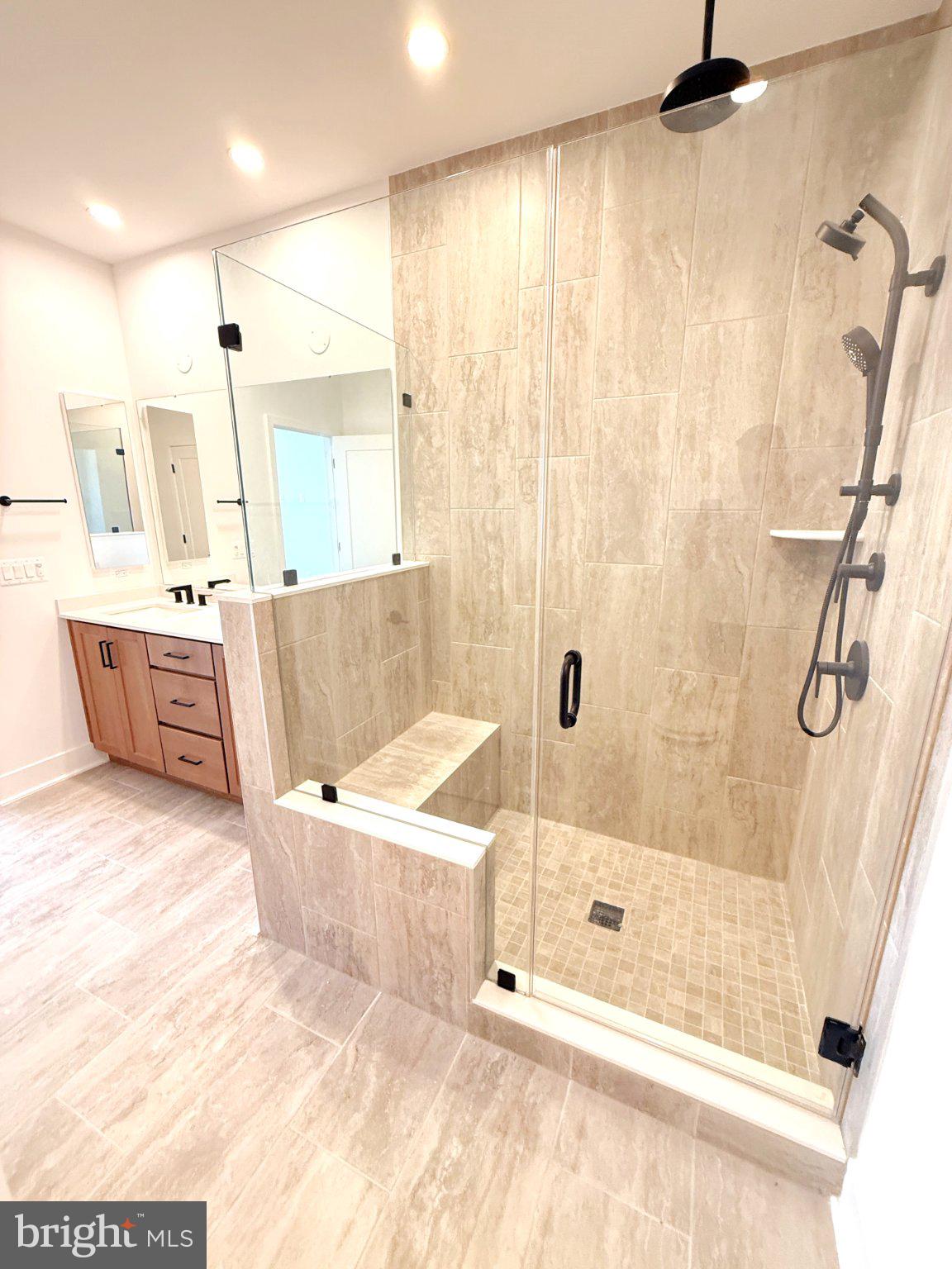 33 Lower Service Court Northwest Washington, DC 20001 - Photo 34 of 51 Sleek modern shower with elegant tiles.