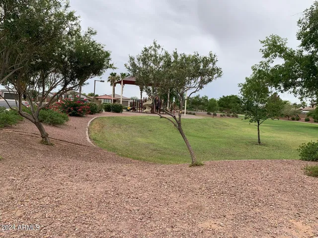 a view of a golf course with a lake