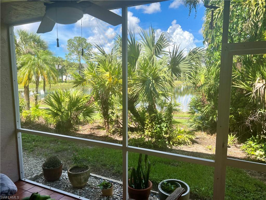 121 Gabriel Circle, Unit 7 Naples, FL 34104 - Photo 18 of 20 Unfurnished sunroom featuring a water view, ceiling fan, and a healthy amount of sunlight