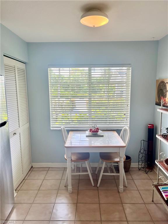 121 Gabriel Circle, Unit 7 Naples, FL 34104 - Photo 4 of 20 View of tiled dining space
