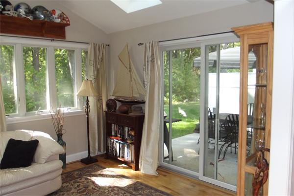 218 Rangeway Road, Unit 283 Billerica, MA 01862 - Photo 11 of 30 a living room with furniture and a floor to ceiling window