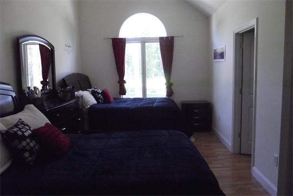 218 Rangeway Road, Unit 283 Billerica, MA 01862 - Photo 21 of 30 a bedroom with a bed and a large window