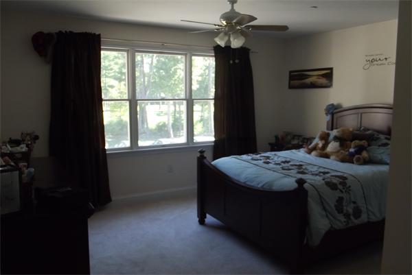 218 Rangeway Road, Unit 283 Billerica, MA 01862 - Photo 22 of 30 a bed sitting in a bedroom next to a window
