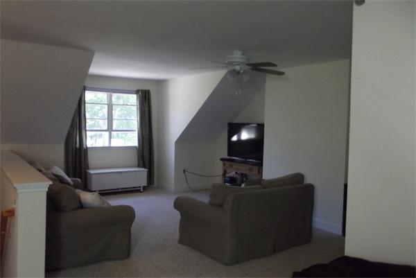 218 Rangeway Road, Unit 283 Billerica, MA 01862 - Photo 27 of 30 a living room with furniture and a flat screen tv