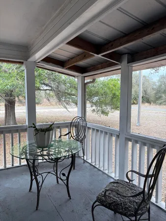 a dining room with furniture window and outside view