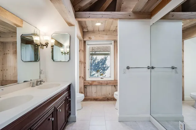 a bathroom with a sink and mirror