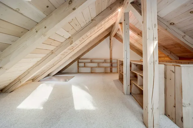 an aerial view of a houses with a lake view