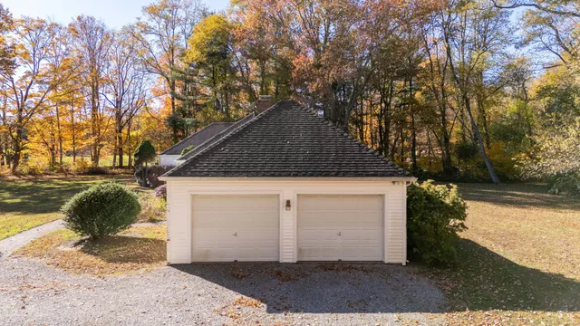 a view of a livingroom with wooden floor a fireplace