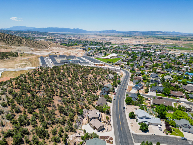 790 East Fiddlers Canyon Road Cedar City, UT 84721 - Photo 34 of 35 Expansive aerial perspective showcasing varied residential developments, a winding road, and natural landscapes
