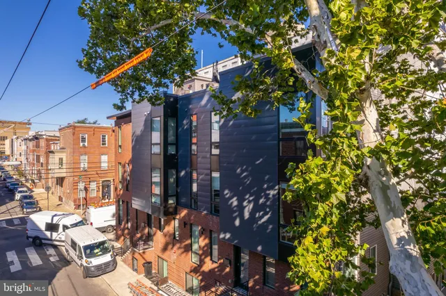 a view of a house with a tree