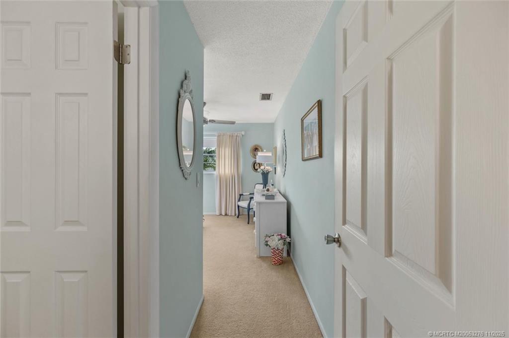 2929 Southeast Ocean Boulevard, Unit 1157 Stuart, FL 34996 - Photo 16 of 26 a view of a hallway with closet and a livingroom view