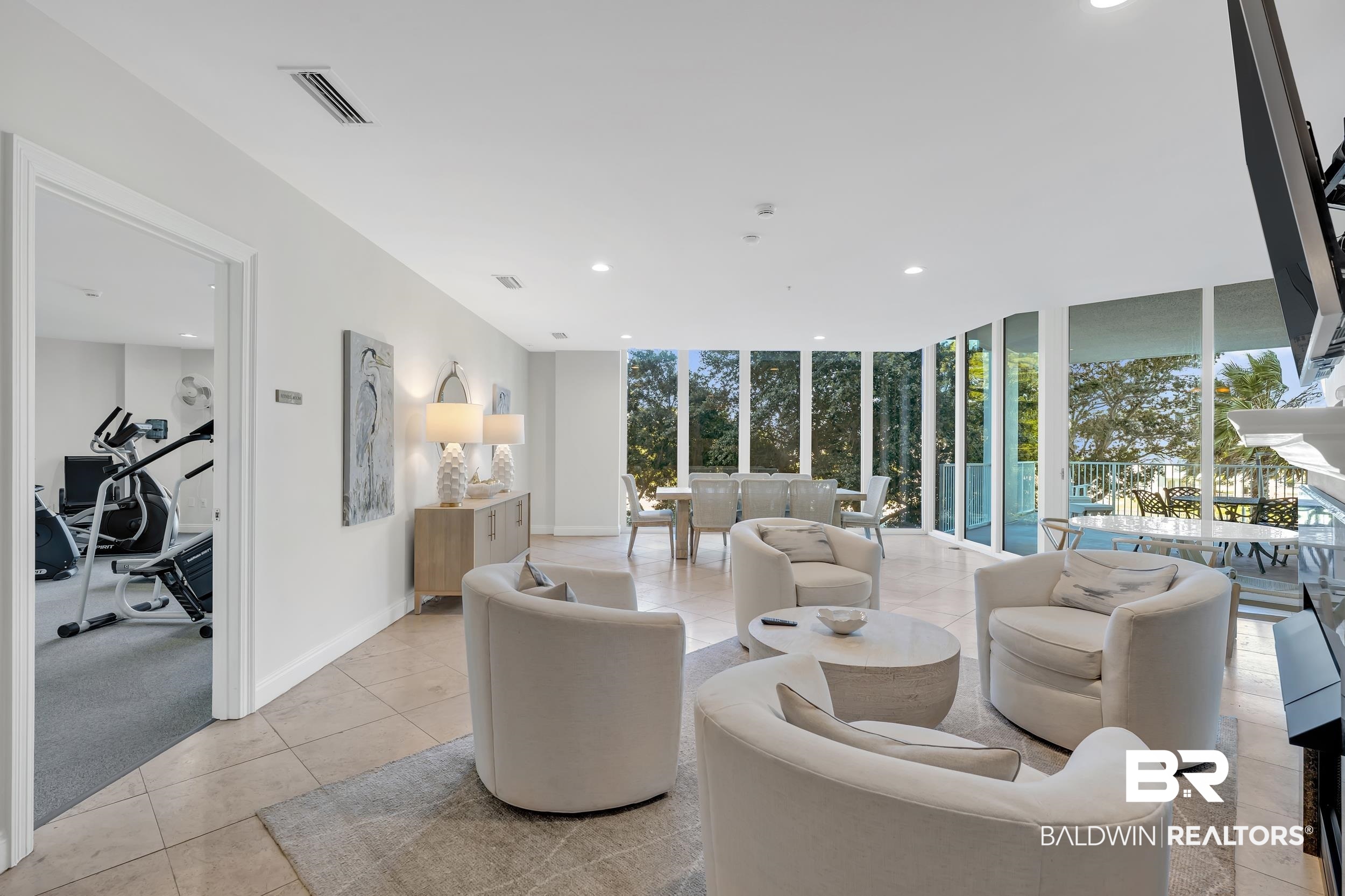 28250 Canal Road, Unit 307 Orange Beach, AL 36561 - Photo 45 of 56 Living room with floor to ceiling windows, recessed lighting, light tile patterned floors, and light colored carpet