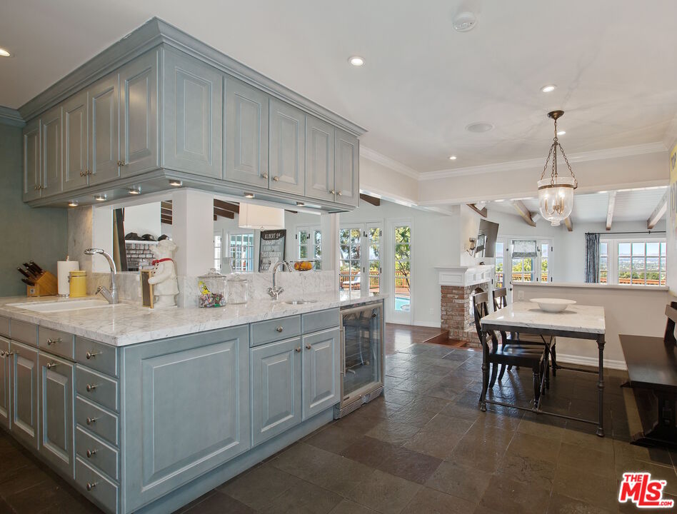 3333 Wrightwood Drive Studio City, CA 91604 - Photo 12 of 33 a kitchen with cabinets and chairs