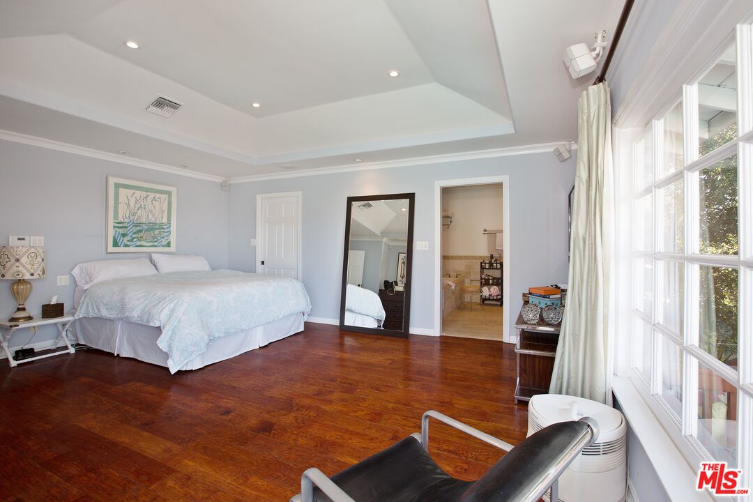 3333 Wrightwood Drive Studio City, CA 91604 - Photo 16 of 33 a spacious bedroom with a bed and a large window