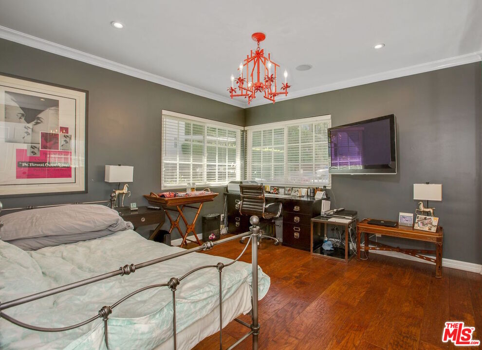 3333 Wrightwood Drive Studio City, CA 91604 - Photo 18 of 33 a bed room with furniture and a chandelier