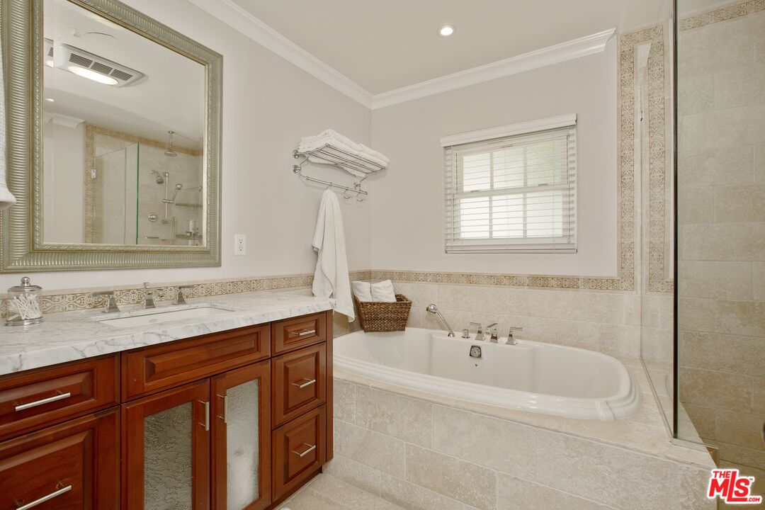 3333 Wrightwood Drive Studio City, CA 91604 - Photo 19 of 33 a bathroom with a tub sink and mirror