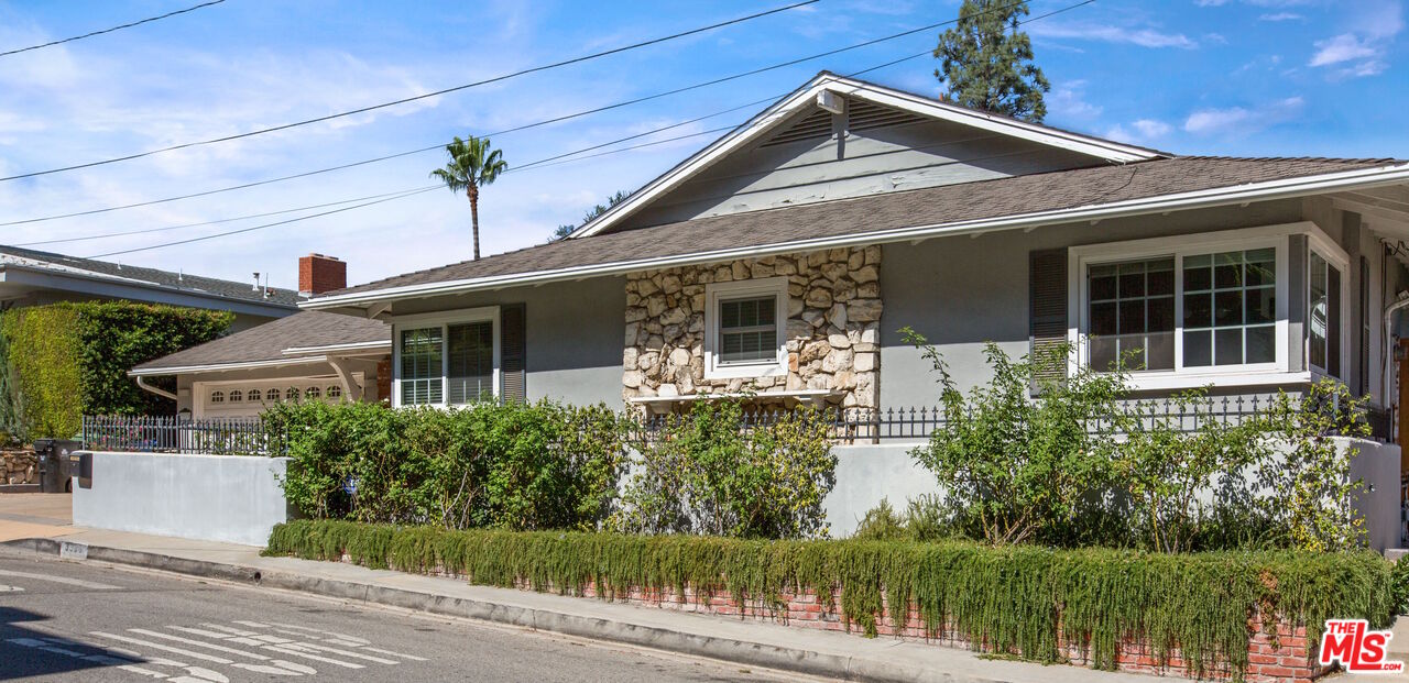3333 Wrightwood Drive Studio City, CA 91604 - Photo 3 of 33 a front view of a house with a yard