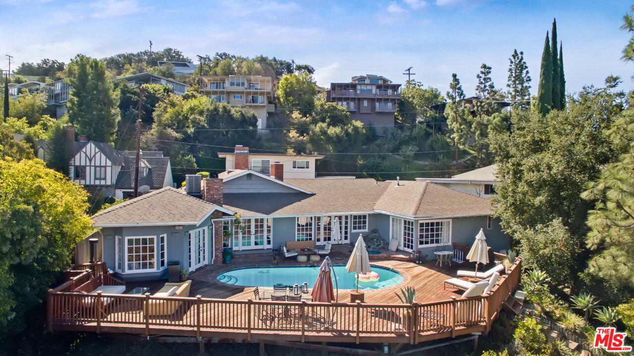 3333 Wrightwood Drive Studio City, CA 91604 - Photo 29 of 33 an aerial view of a house with swimming pool lawn chairs and a fire pit