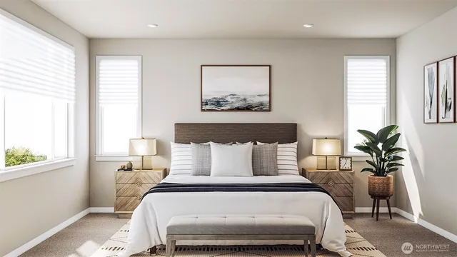 a bedroom with a large bed and a potted plant