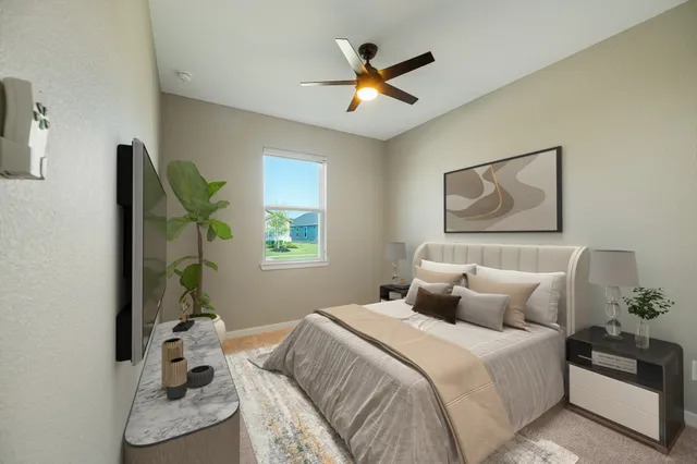 a bedroom with a bed and a window