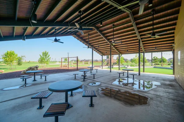 a view of swimming pool with outdoor seating
