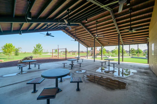 a view of swimming pool with outdoor seating