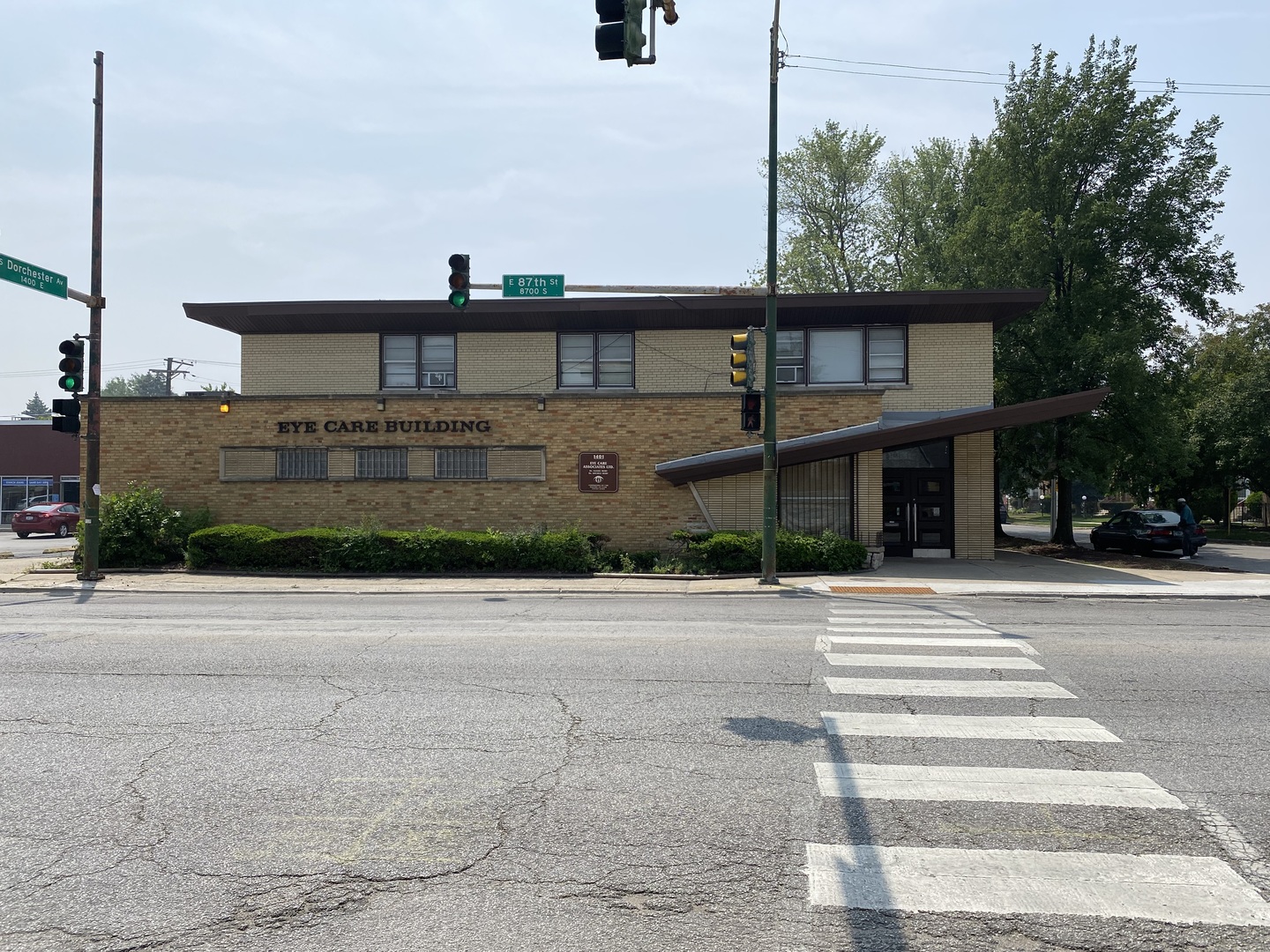 1401 East 87th Street Chicago, IL 60619 - Photo 2 of 5 a front view of a house with a yard