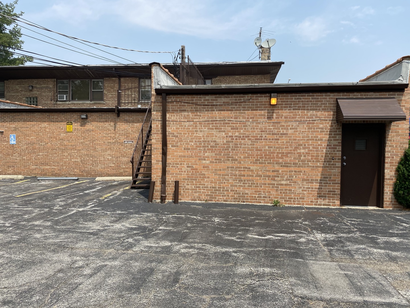 1401 East 87th Street Chicago, IL 60619 - Photo 4 of 5 a front view of a building with entryway