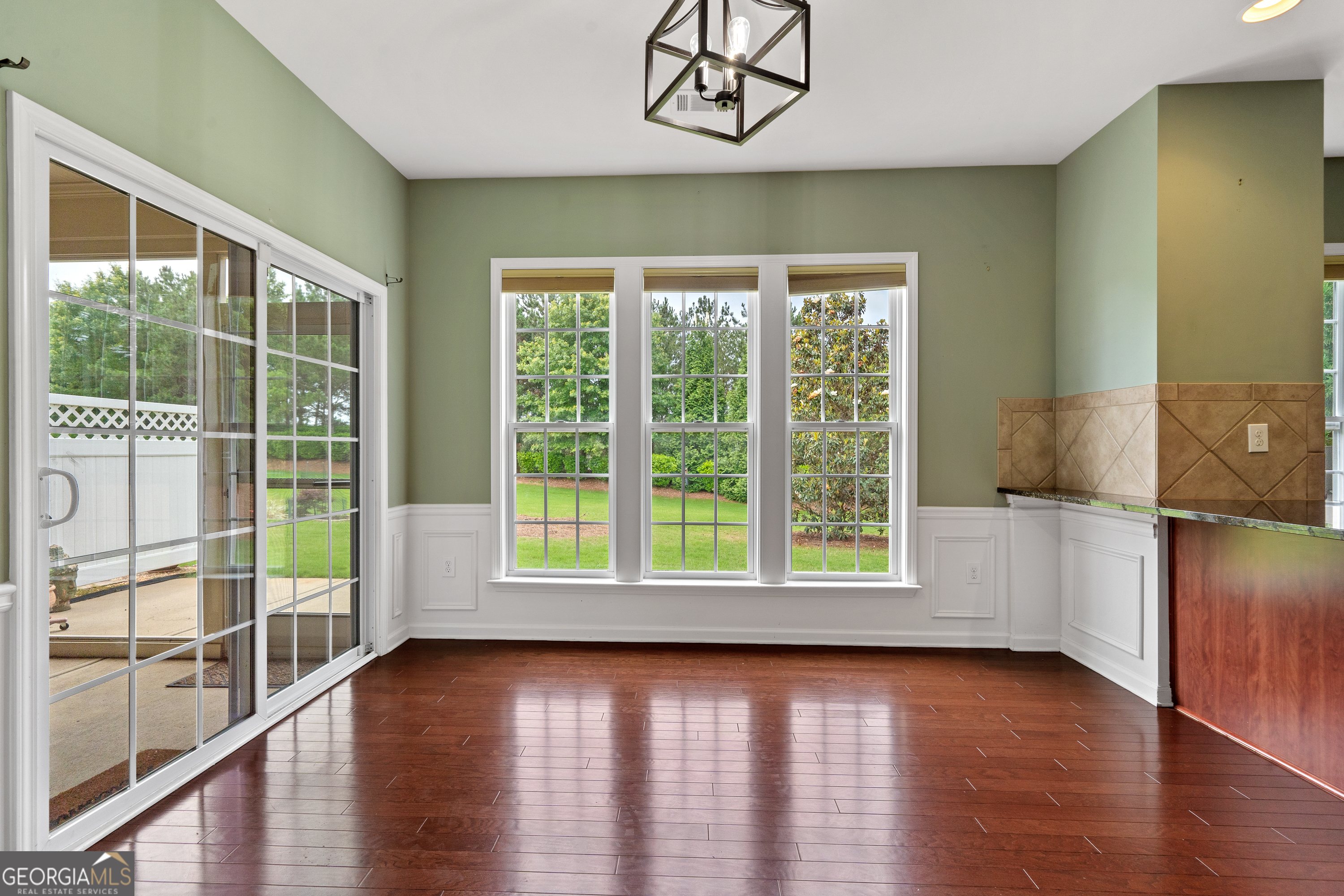 1370 Summer Hollow Road Greensboro, GA 30642 - Photo 12 of 35 an empty room with wooden floor and windows